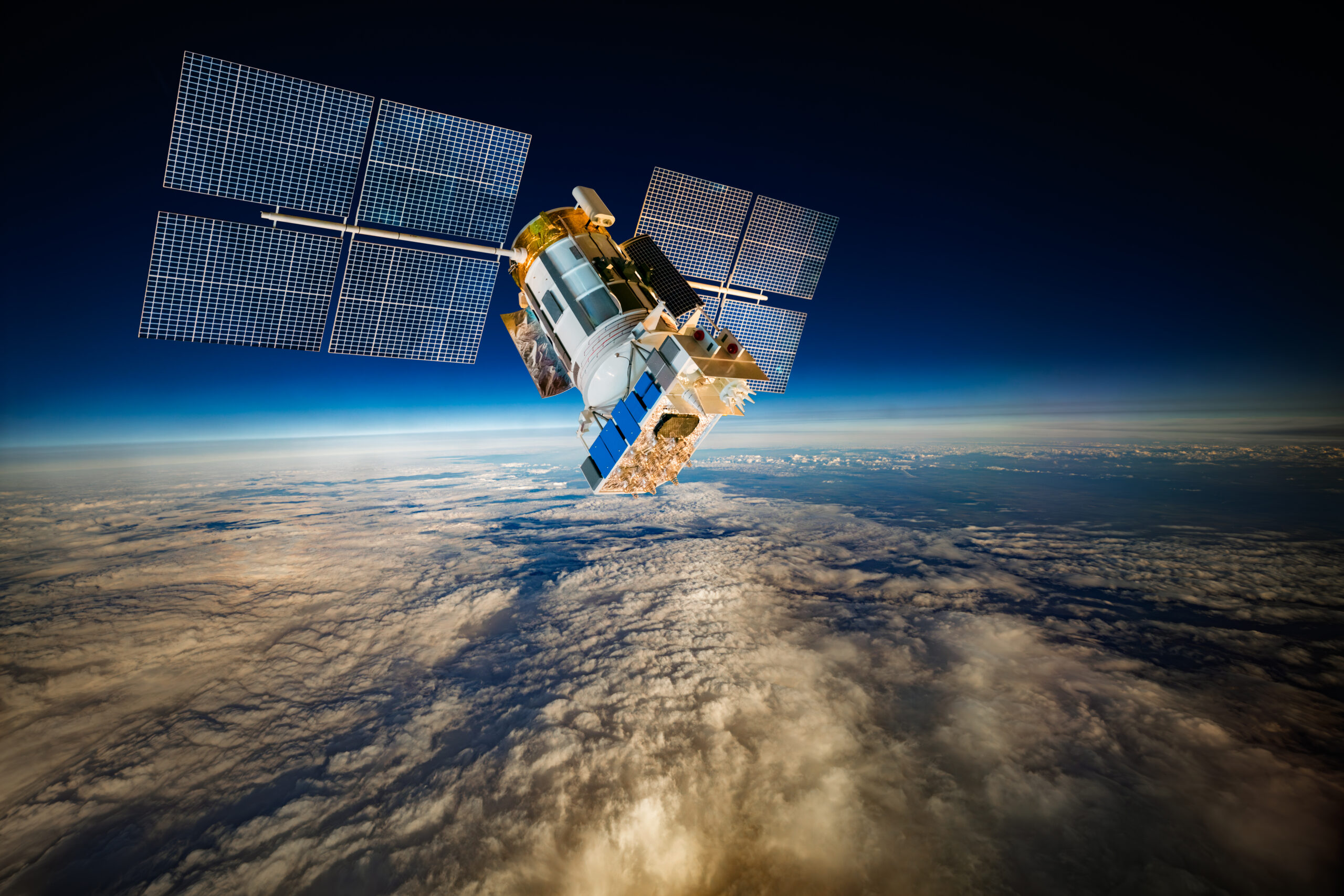 Satellite orbiting Earth in space, representing satellite communications and Earth observation technology.