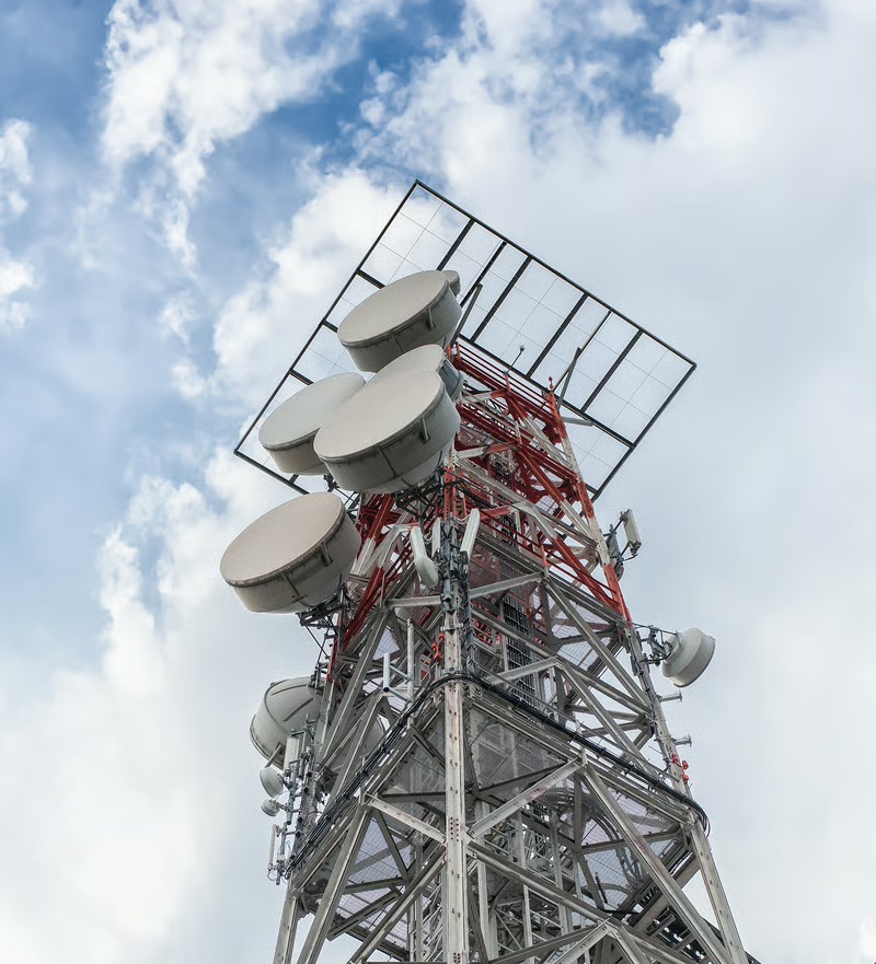 Telecommunications tower supporting ANGOSAT-2 satellite technology and satellite communications infrastructure for digital connectivity